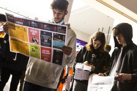 student looking at events map