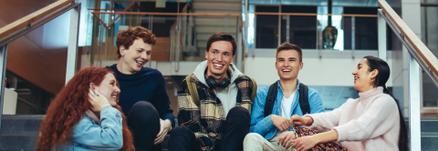 Group of students sitting on stairs